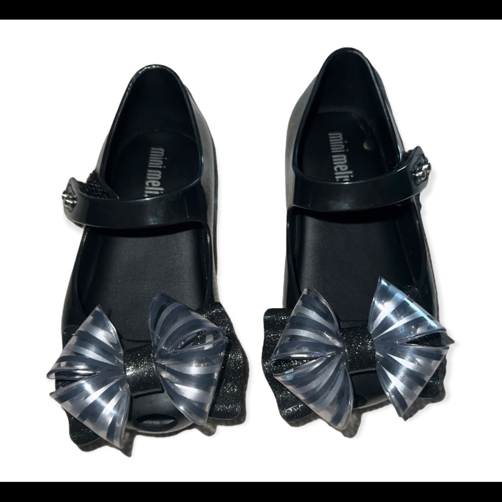 Mini Melissa, size 6, black with clear, black, silver bow.